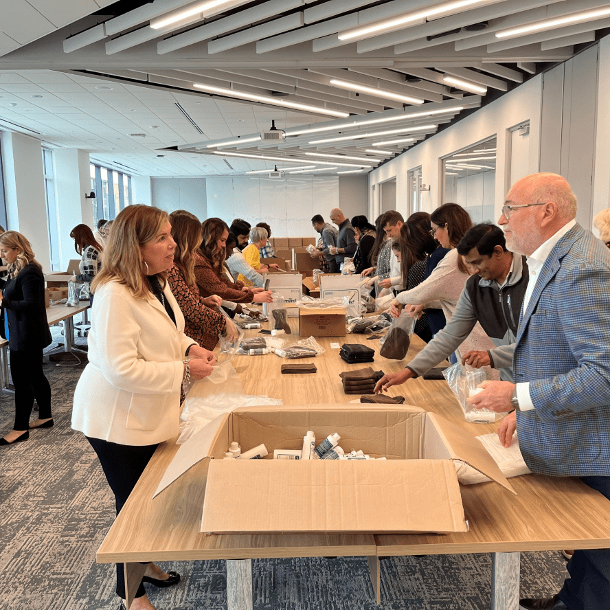 Glamzo leaders and team members work together to pack emergency supplies.